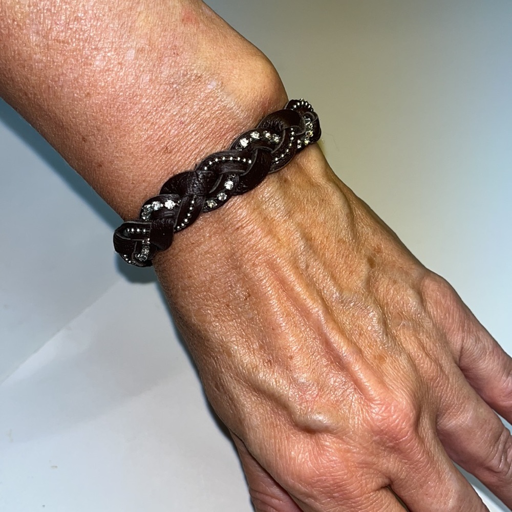 EUC: brown, braided leather with rhinestones in silver beads.